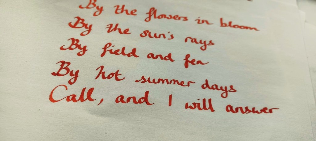 Handwritten text with short poem beginning "By the flowers in bloom..."